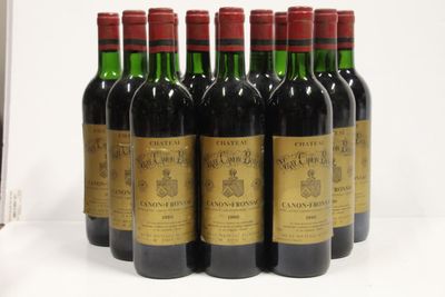 six bottles of wine are lined up in a row on a table
