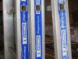 two ladders that are standing next to each other