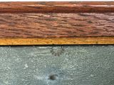 a close up of a piece of wood with a hole in it