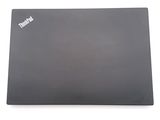 a laptop that is sitting on a white surface