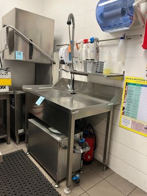 a kitchen with stainless steel appliances and a sink