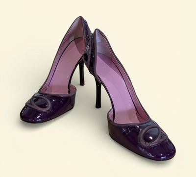 purple high heel shoes with a black heel and a purple heel