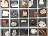 a close up of a box with rocks and stones in it