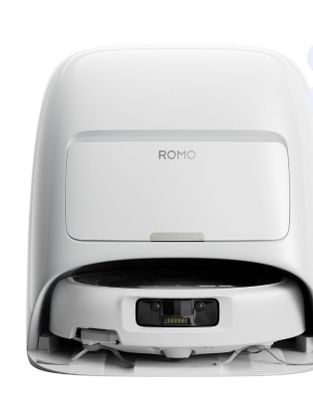 a close up of a white toilet with a remote control