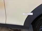a sticker on the side of a white car