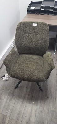 a chair that is sitting in the corner of a room