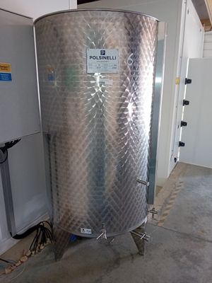 a large stainless steel tank sitting in the middle of a room