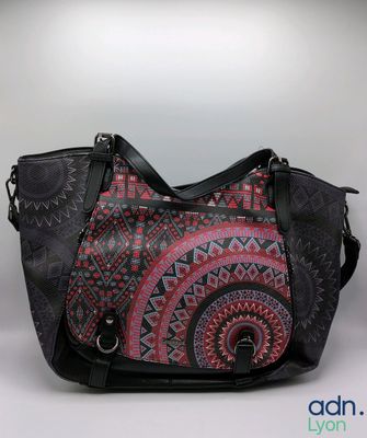 an image of a black and pink purse with a pattern on it