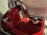 a red machine that is sitting on a table