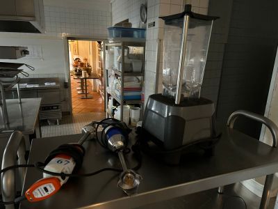 a blender sitting on top of a table in a kitchen