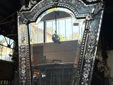 a mirror that is sitting on a table in a room
