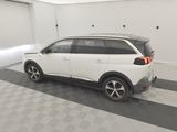 the white car is parked in the garage of the building