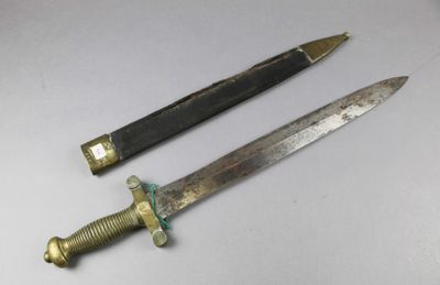 two different types of knives on a white surface