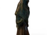 bronze statue of a woman with a hood on her head and a hood over her head