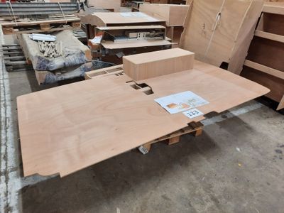 a lot of furniture that is being assembled in a warehouse
