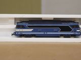 a toy train sitting in a white box on a table