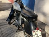 a motorcycle that is parked on the side of the street