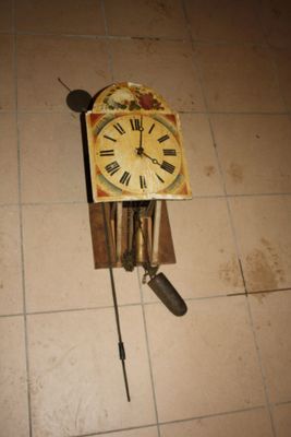 a clock that is on the floor on the floor