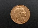 a close up of a coin with a woman ' s head on it
