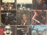 several records of miles davis are on display on a table