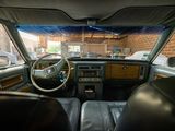 a view of the inside of a car from the driver ' s seat