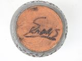a close up of a baseball with a signature on it