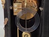 a black and gold clock that is on display