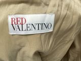 red valentino label on the back of a tan jacket