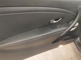 the interior of a car with the door open showing the interior of the vehicle