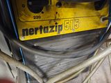 a yellow sign on the side of a yellow machine