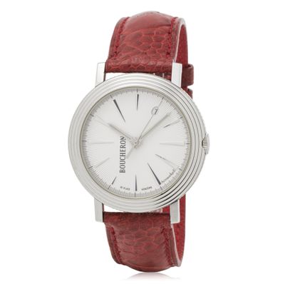 a close up of a watch on a white background with a red strap