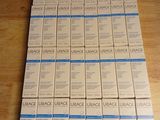 a stack of white boxes sitting on a wooden table