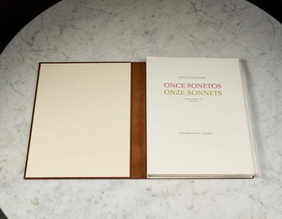 a book sitting on top of a table on a marble table