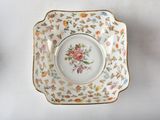 a white plate with a floral design on it