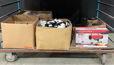 boxes and boxes on a cart in the back of a truck