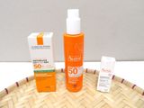 a bottle of sunscreen and a box of sunscreen on a basket