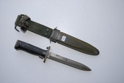 two knives that are laying next to each other on a table