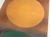 yellow and green plates sitting on top of a wooden table