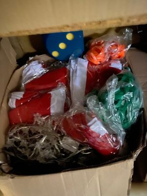 a cardboard box filled with assorted items in it