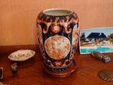 a vase that is sitting on a table with other items