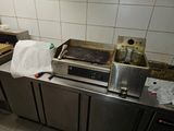 an image of a kitchen with a stove and a counter