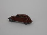 a small toy car that is sitting on a white surface