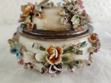 a small box with flowers on it on a table