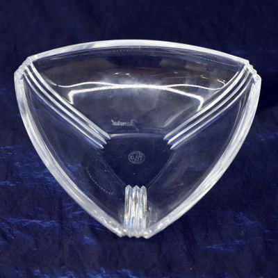 a clear glass bowl on a blue table cloth