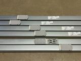 four different types of metal rails with labels on them