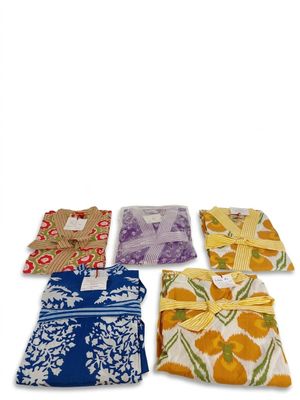 four pieces of cloth with different designs on them