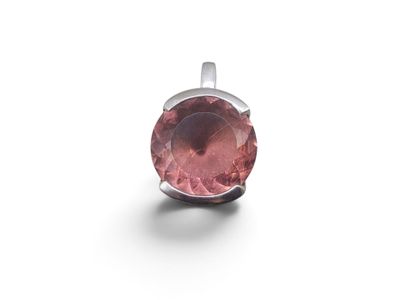 a close up of a pink tourmaline gemstone pendant on a white background