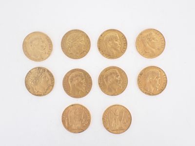six different types of gold coins arranged in the shape of a heart