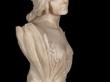 marble bust of a woman on a marble pedestal