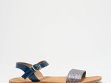 a picture of a pair of blue sandals on a white background